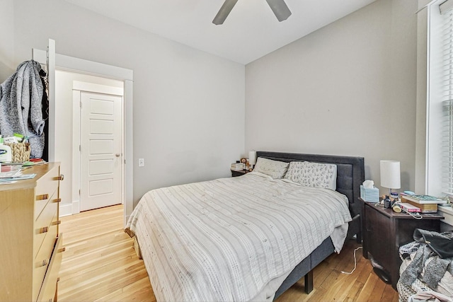 bedroom with ceiling fan and light wood-style floors