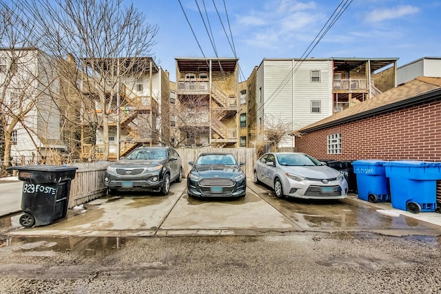 view of parking with a residential view