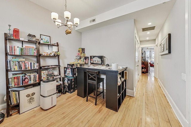 office area featuring baseboards, an inviting chandelier, visible vents, and light wood-style floors