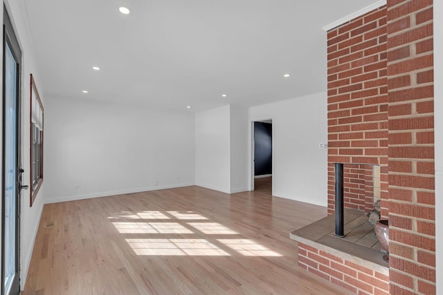 unfurnished living room with light wood-type flooring