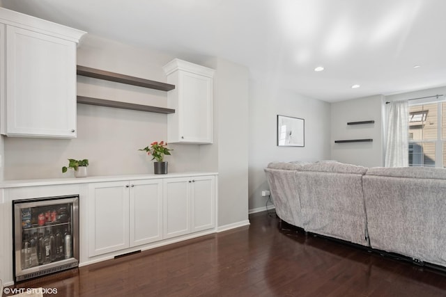 living room with recessed lighting, beverage cooler, baseboards, and dark wood-style flooring