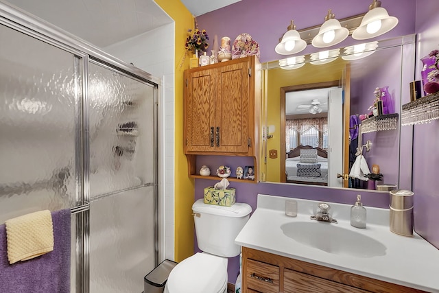 bathroom with vanity, toilet, and walk in shower