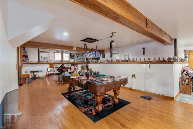 playroom with wood-type flooring, beamed ceiling, and pool table