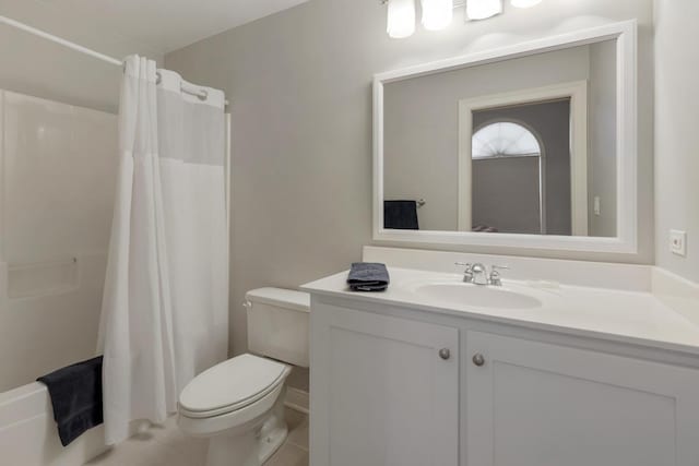 full bathroom with curtained shower, tile patterned flooring, vanity, and toilet