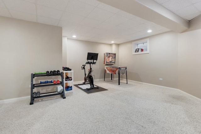 exercise area with baseboards, a drop ceiling, and recessed lighting