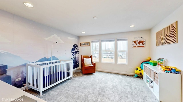 carpeted bedroom with recessed lighting, baseboards, and a nursery area