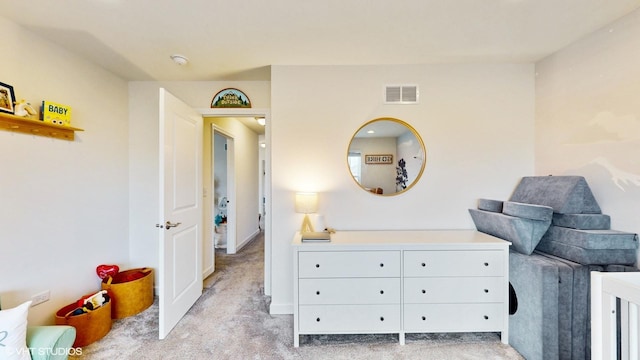 bedroom featuring visible vents and light colored carpet