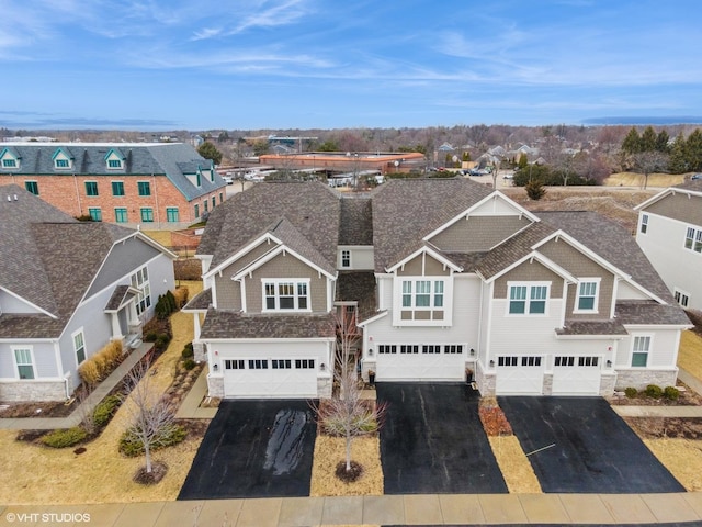 birds eye view of property with a residential view