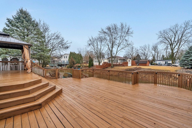 deck with a residential view and a gazebo