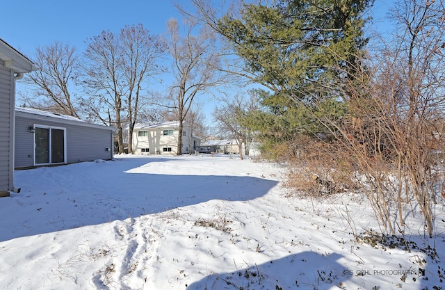 view of yard covered in snow