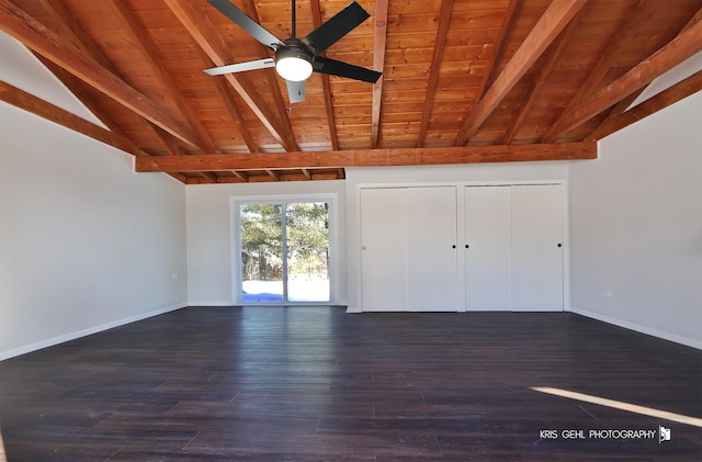 unfurnished bedroom with wooden ceiling, two closets, dark hardwood / wood-style flooring, and vaulted ceiling with beams