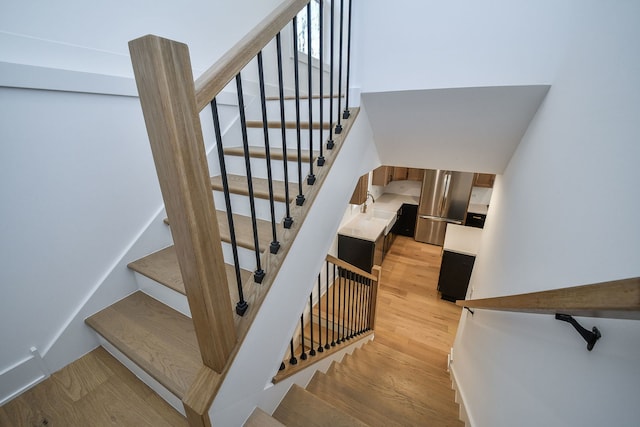 stairway featuring hardwood / wood-style floors