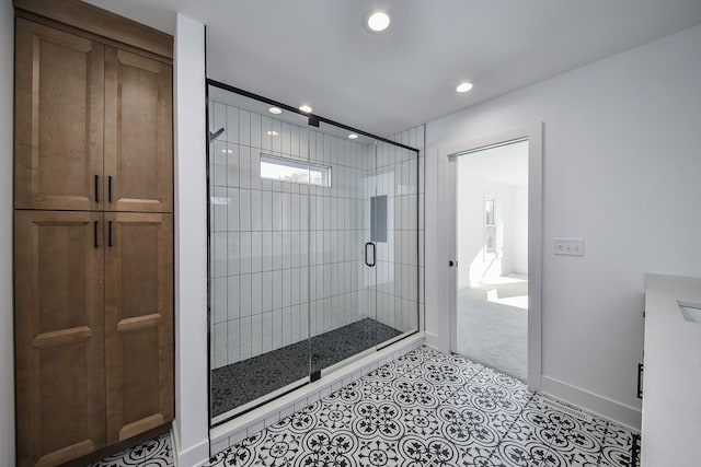 bathroom with walk in shower and tile patterned floors