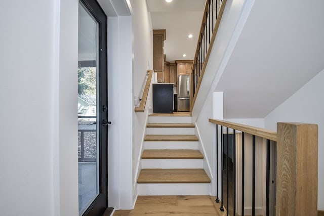 stairway with wood-type flooring