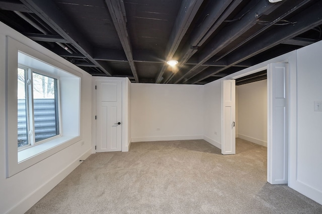 basement with light colored carpet