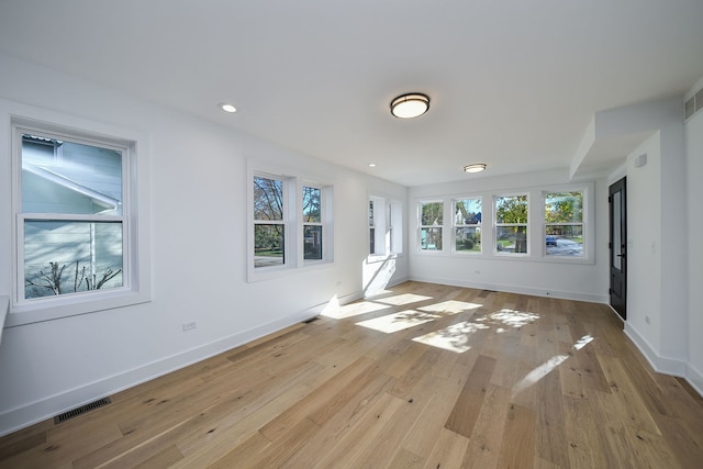 spare room with light wood-type flooring