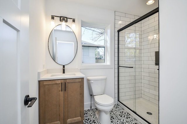 bathroom featuring vanity, tile patterned flooring, a shower with door, and toilet