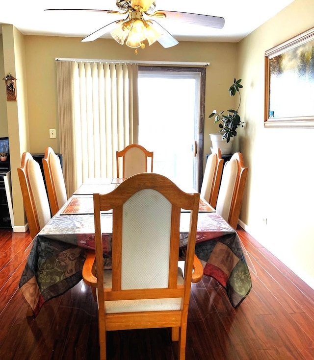 dining room featuring ceiling fan, a healthy amount of sunlight, and hardwood / wood-style floors