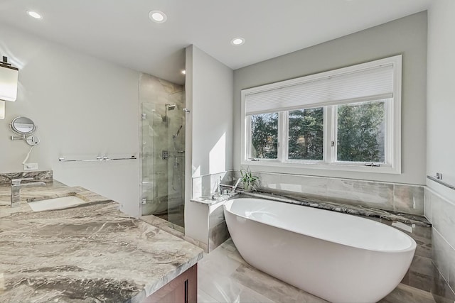 627 68th St, Willowbrook, IL 60527 - bathroom featuring a soaking tub, marble finish floor, vanity, and a shower stall