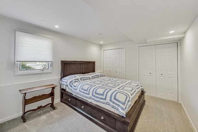627 68th St, Willowbrook, IL 60527 - bedroom with recessed lighting, baseboards, two closets, and light carpet