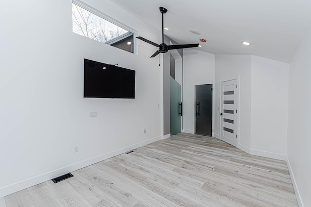 unfurnished living room featuring high vaulted ceiling, ceiling fan, and light wood-type flooring