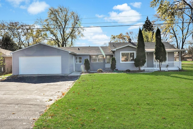 ranch-style house featuring an attached garage, driveway, a chimney, and a front yard