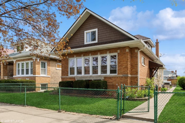 view of front of property with a front yard, a fenced front yard, brick siding, a gate, and a chimney
