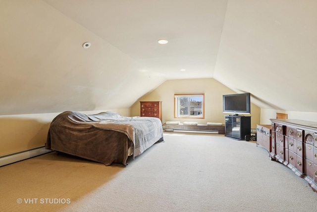 bedroom featuring lofted ceiling, baseboard heating, a baseboard heating unit, and carpet floors