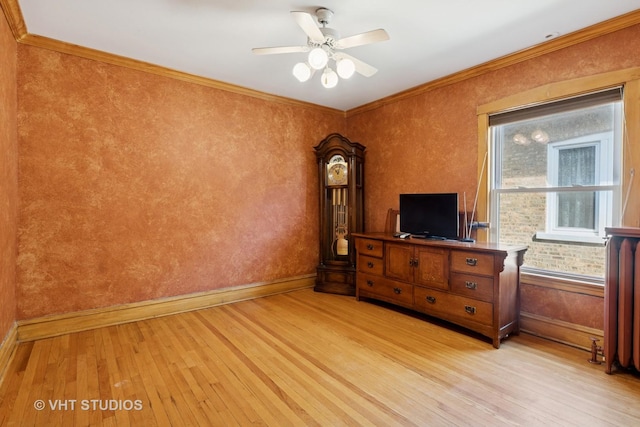bedroom with light wood-style floors, a ceiling fan, ornamental molding, and baseboards