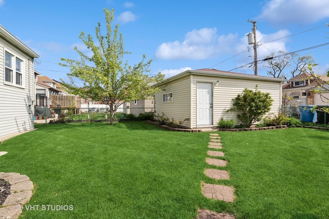 view of yard with an outdoor structure and a fenced backyard