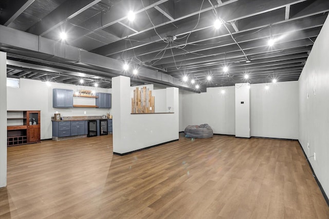 finished basement with indoor wet bar and light wood-style floors