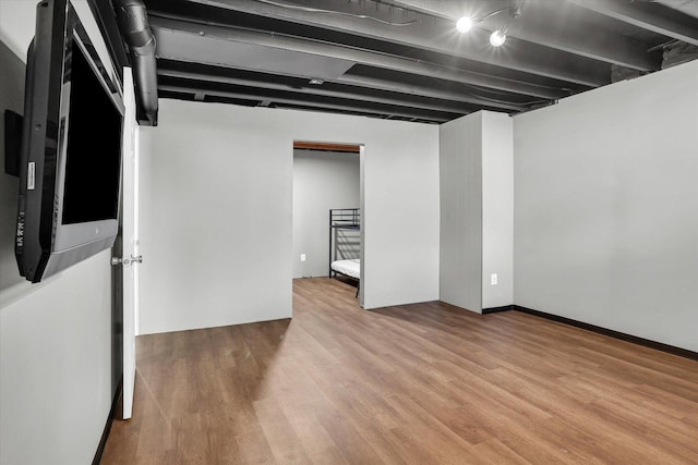 finished basement featuring light wood-type flooring