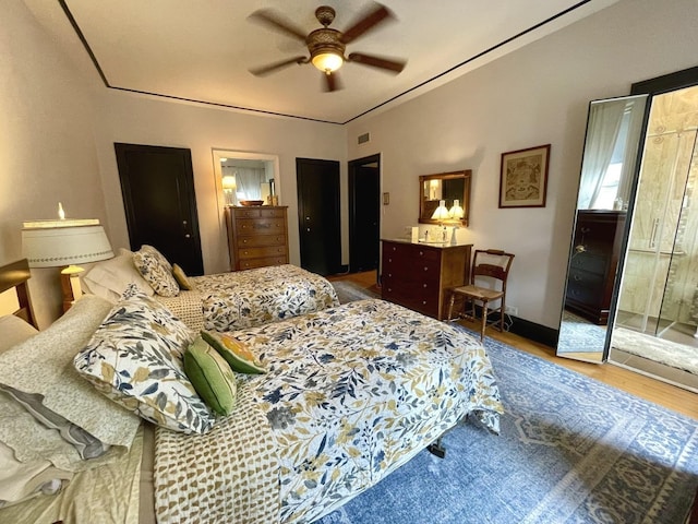 bedroom with ceiling fan and wood finished floors