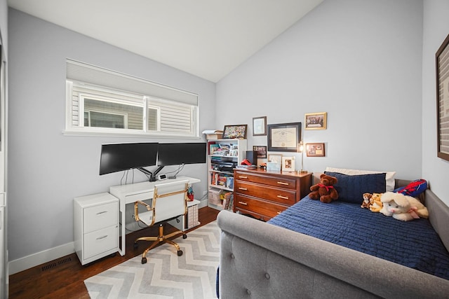 bedroom featuring lofted ceiling, baseboards, visible vents, and wood finished floors