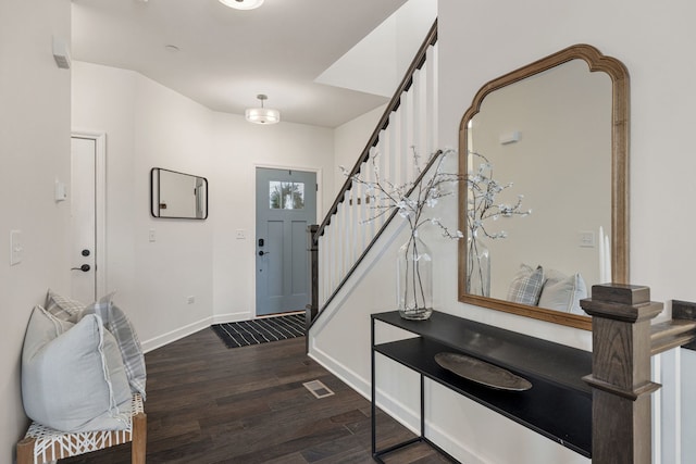 entryway with dark wood-type flooring