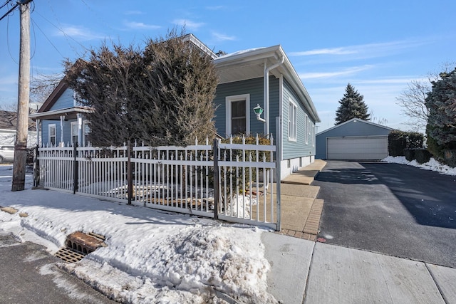 view of front of property featuring an outbuilding and a garage