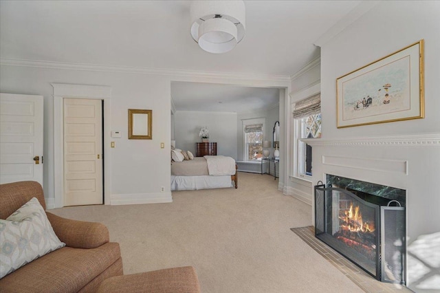 bedroom with light carpet, a fireplace with flush hearth, ornamental molding, and baseboards