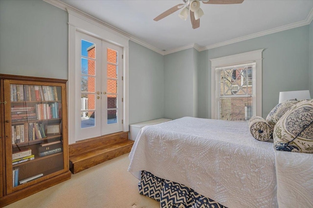 bedroom featuring french doors, crown molding, a ceiling fan, carpet flooring, and access to outside