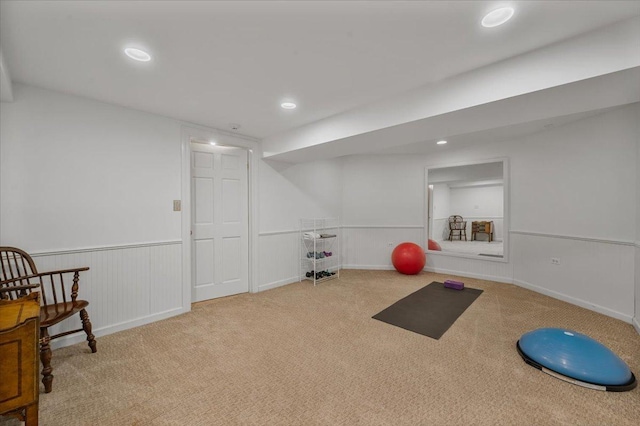 exercise room with recessed lighting, carpet, and wainscoting