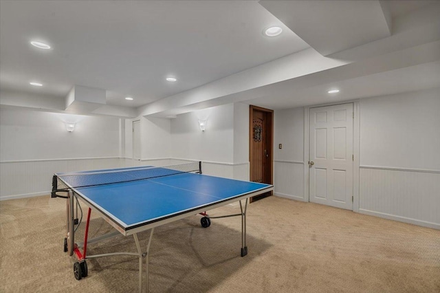 game room featuring recessed lighting, a wainscoted wall, and light colored carpet