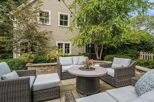 view of patio / terrace featuring outdoor lounge area and fence