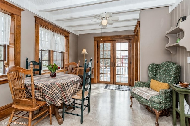 dining space featuring french doors, baseboards, beamed ceiling, and a ceiling fan