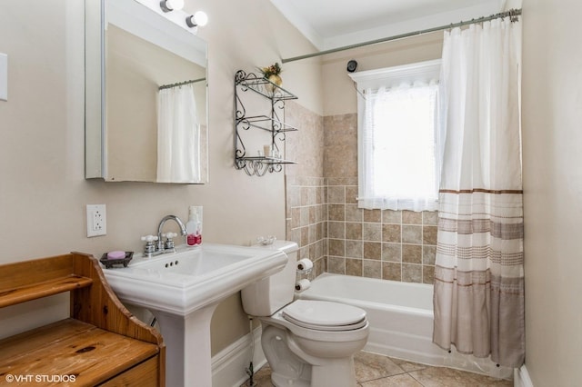 full bath featuring tile patterned floors, a sink, toilet, and shower / bathtub combination with curtain