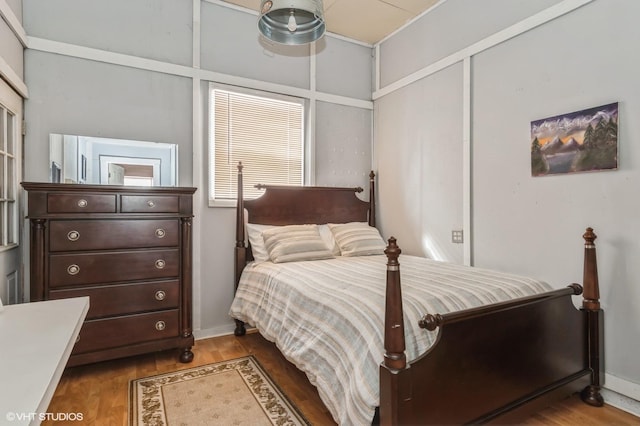 bedroom with wood finished floors