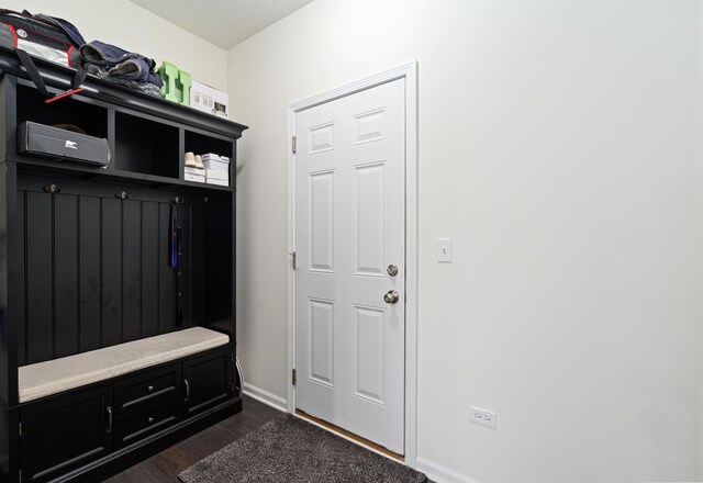 mudroom featuring baseboards and dark wood-style flooring