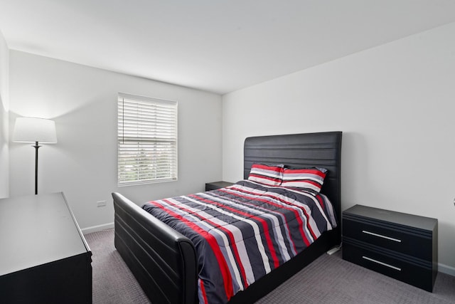 carpeted bedroom with baseboards