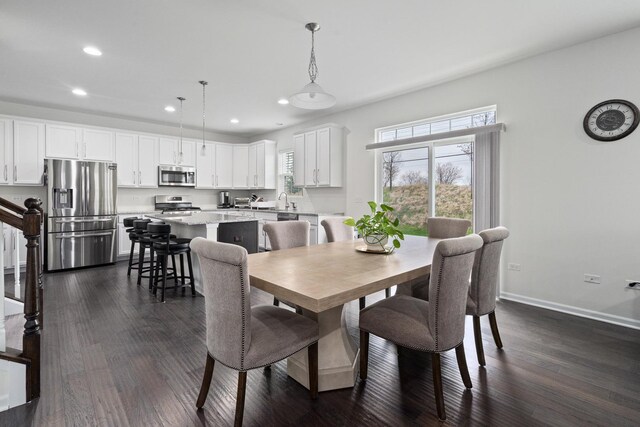 dining area featuring a healthy amount of sunlight, baseboards, recessed lighting, and dark wood-type flooring