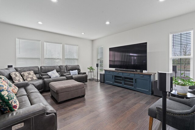 living area with recessed lighting and dark wood-style flooring