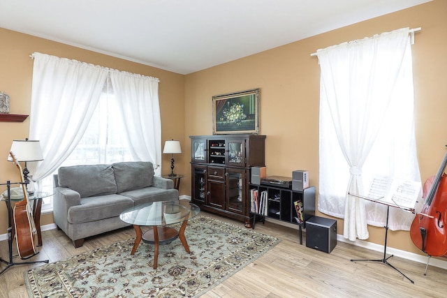 living room with light wood-style floors and baseboards