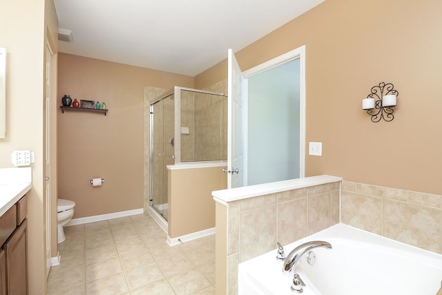 bathroom with a stall shower, a garden tub, vanity, and toilet